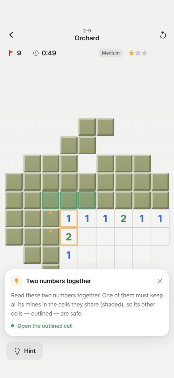 An Orchard board with a hint open. The two numbers behind it are outlined in orange and the safe cells in green. Below, one sentence explains why.